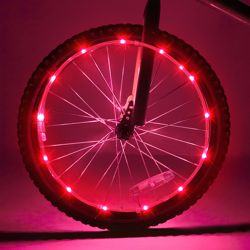 Two colorful LED bike wheel lights wrapped around bicycle spokes, showcasing bright illumination for safety and style.