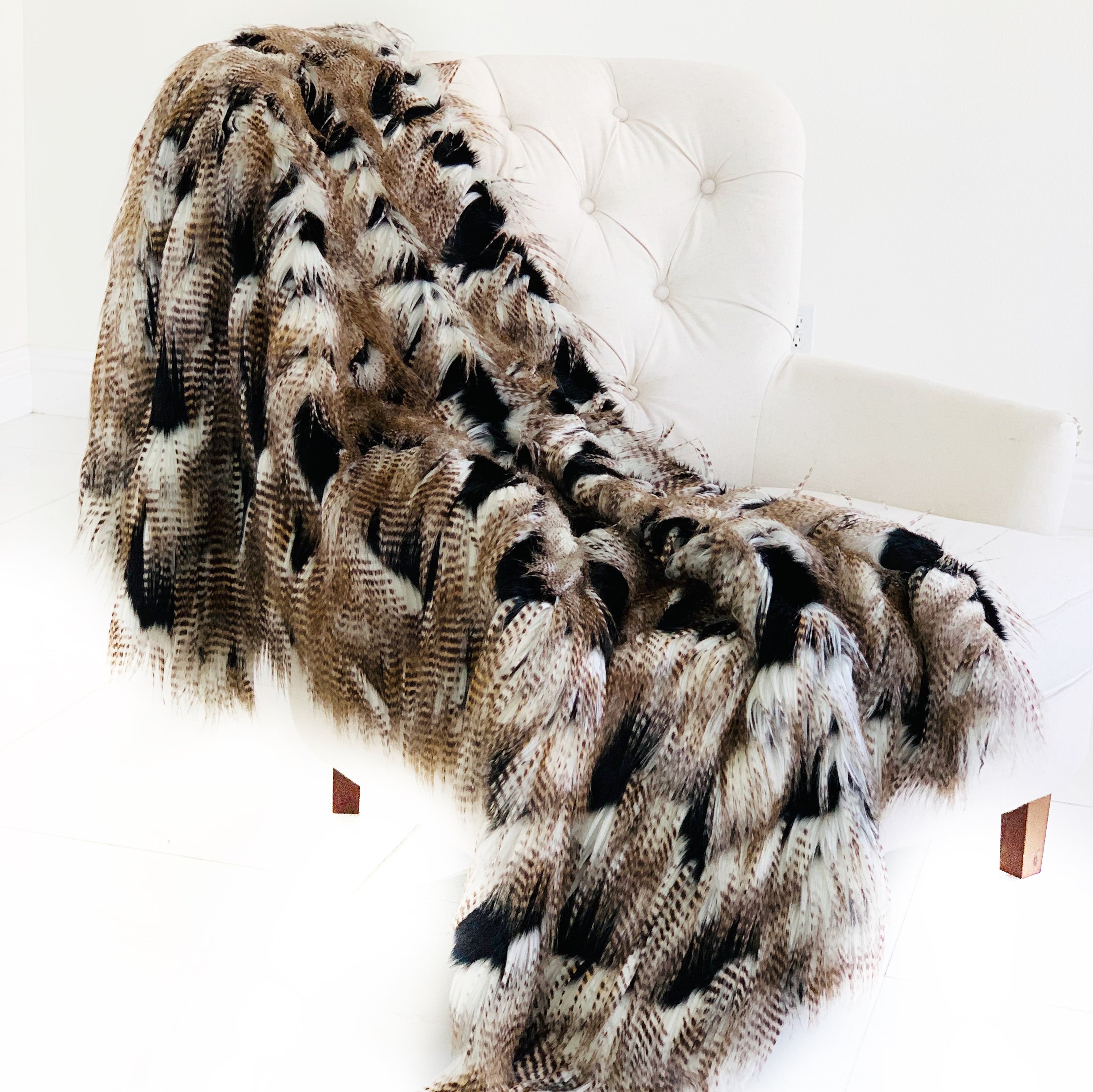 Luxurious black and gold rococo plush throw blanket, handmade with faux fur, showcasing intricate design and reversible feature.