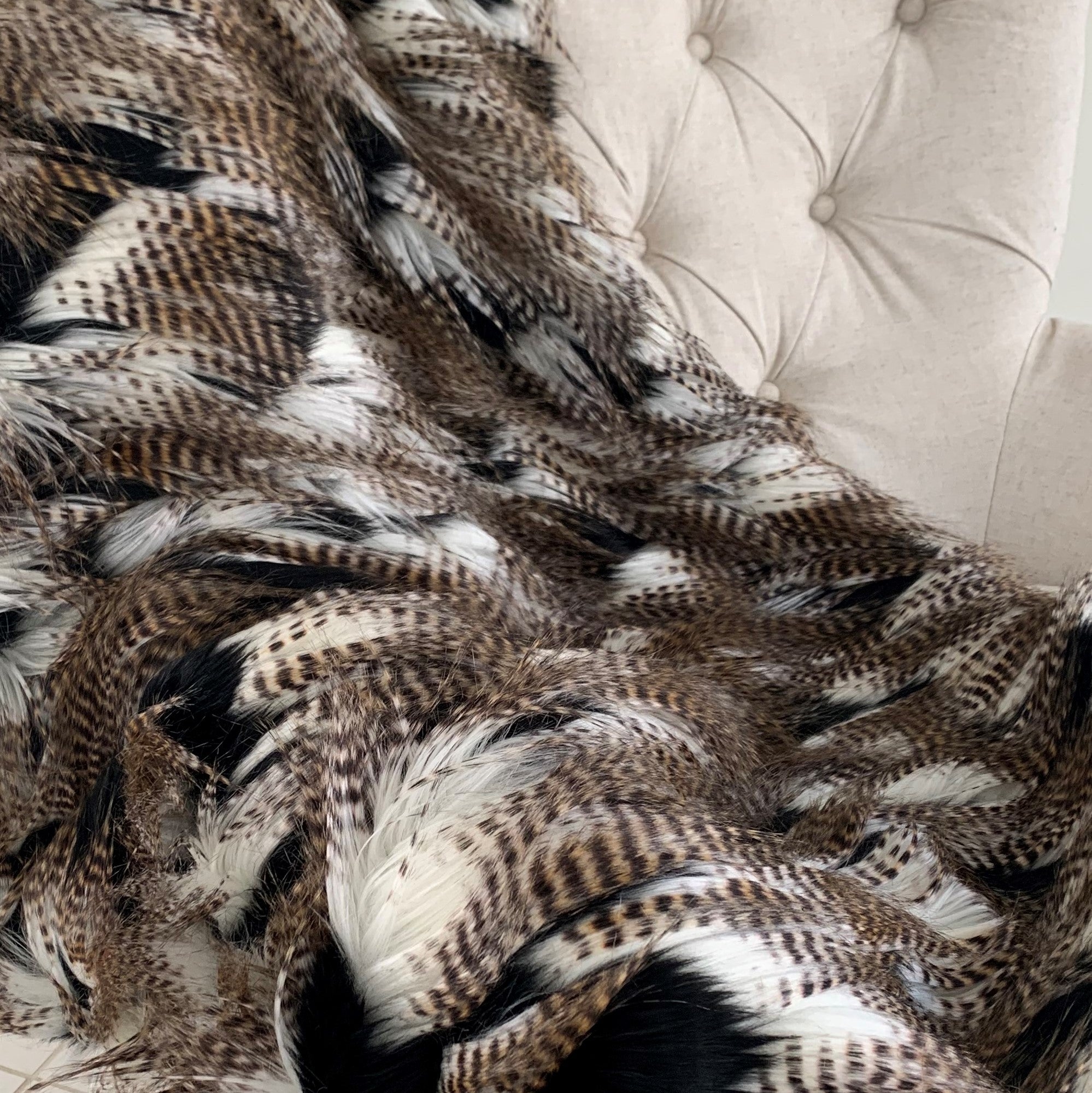 Luxurious black and gold rococo plush throw blanket, handmade with faux fur, showcasing intricate design and reversible feature.