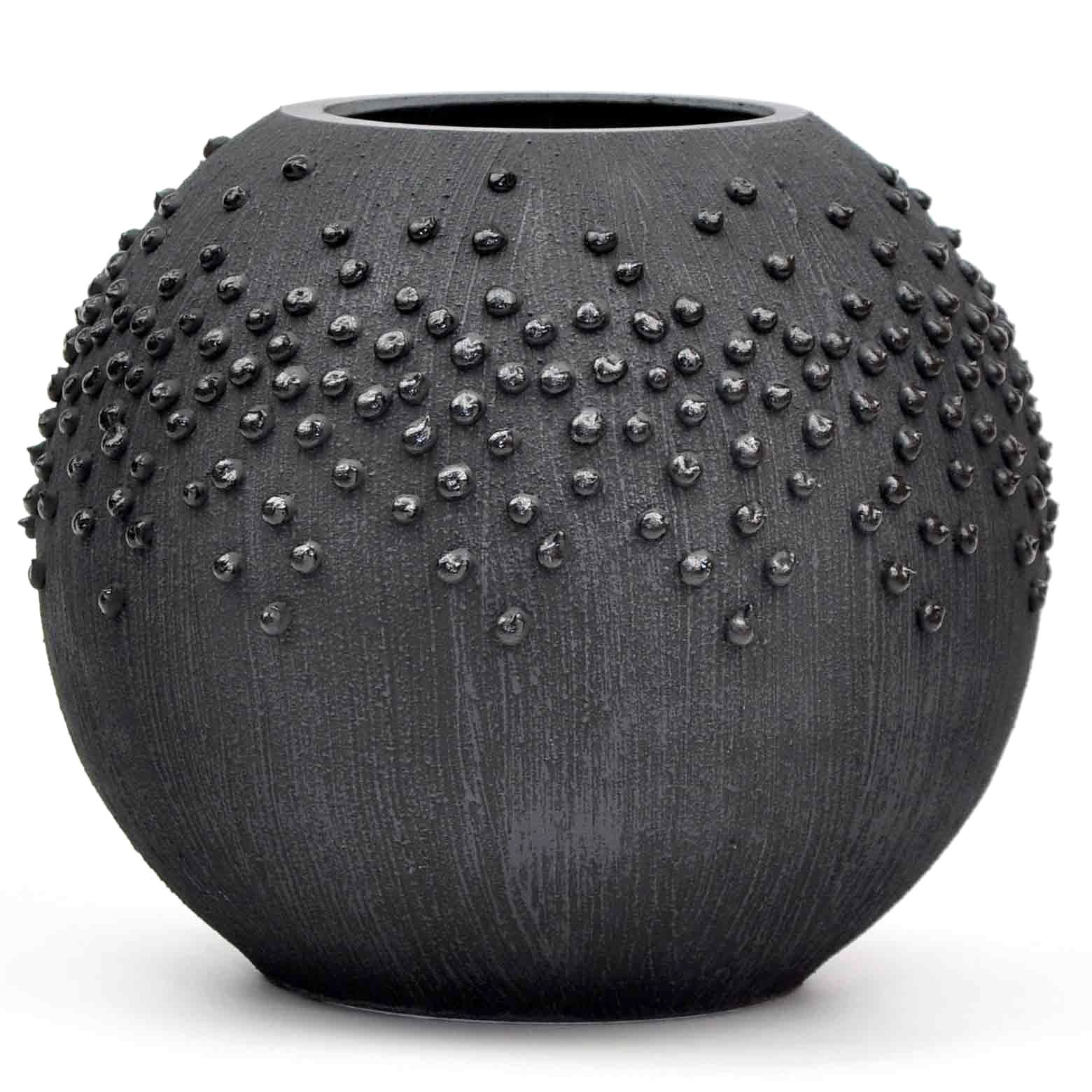 A beautifully hand-painted black glass vase featuring unique artistic designs, perfect for displaying flowers.