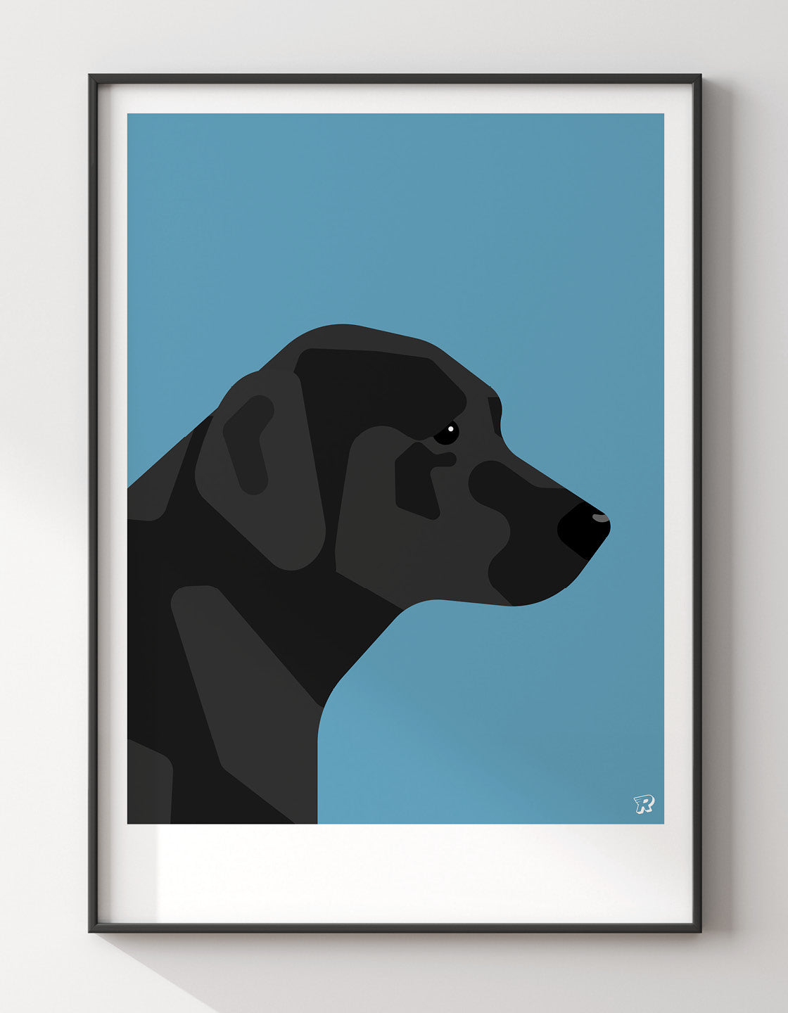 A friendly Black Labrador named Larry, eager to play and hang out with you.