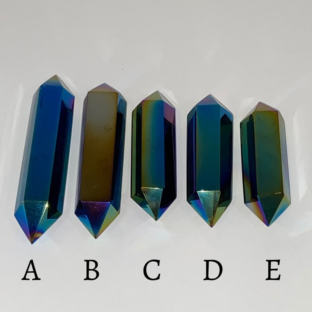 A stunning Black Obsidian Titanium Double Terminated Point with a shiny metallic finish, showcasing its unique double-ended design.