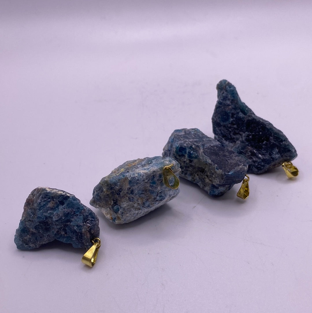 A beautiful Blue Apatite Rough Cut Pendant showcasing its deep aqua color and unique rough texture, perfect for healing and creativity.