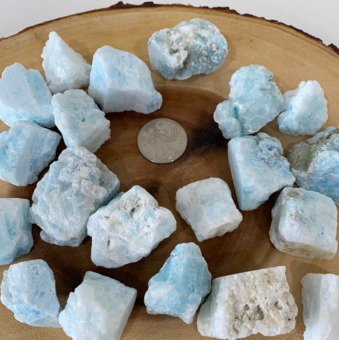 A rough cut piece of blue aragonite showcasing its natural texture and calming blue hues, perfect for grounding and meditation.