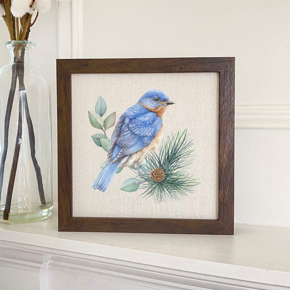Blue Bird Framed Sign with a stylized wood frame and linen-look background, featuring a charming blue bird design.
