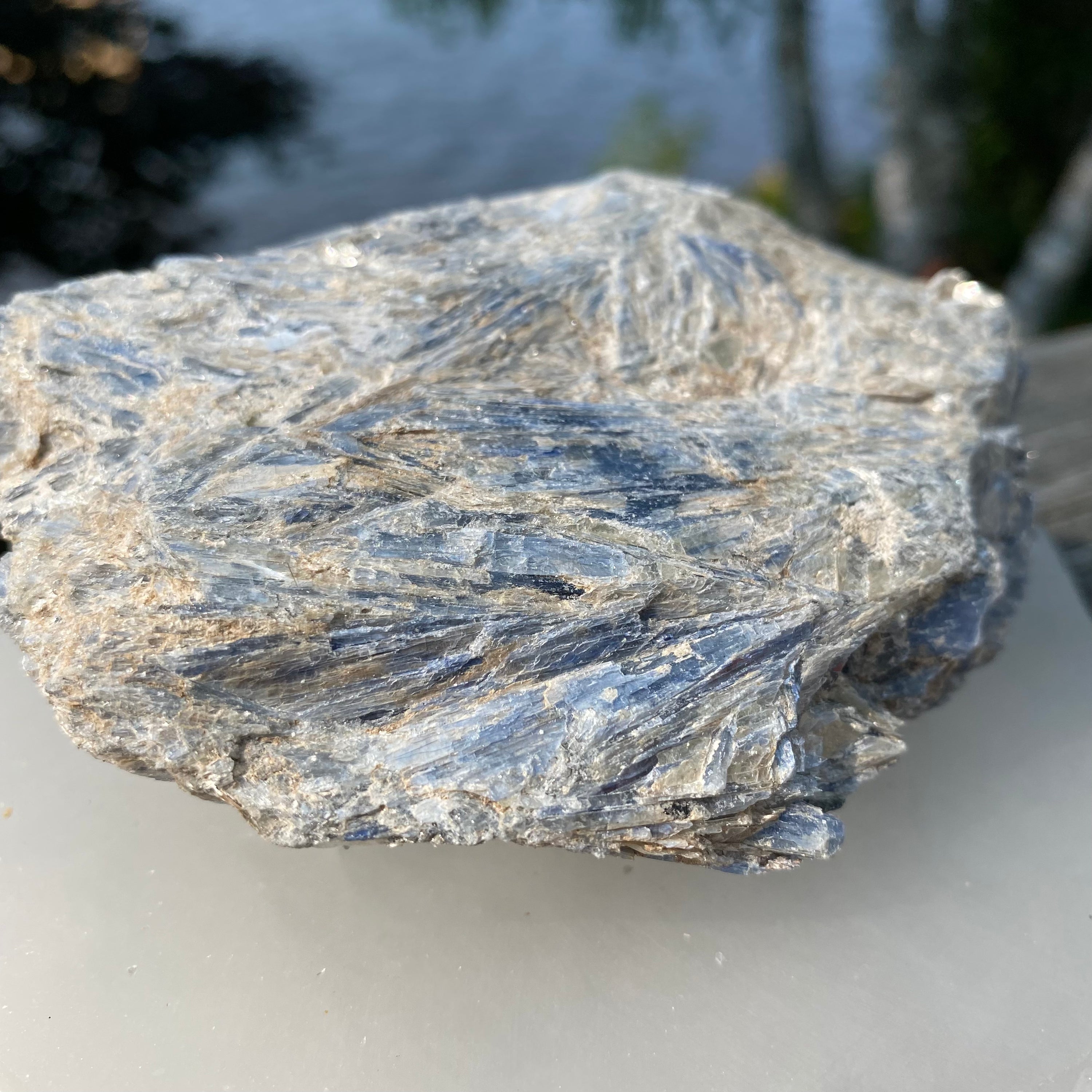 A beautiful light blue Kyanite cluster with Mica inclusions, showcasing its unique natural formations.