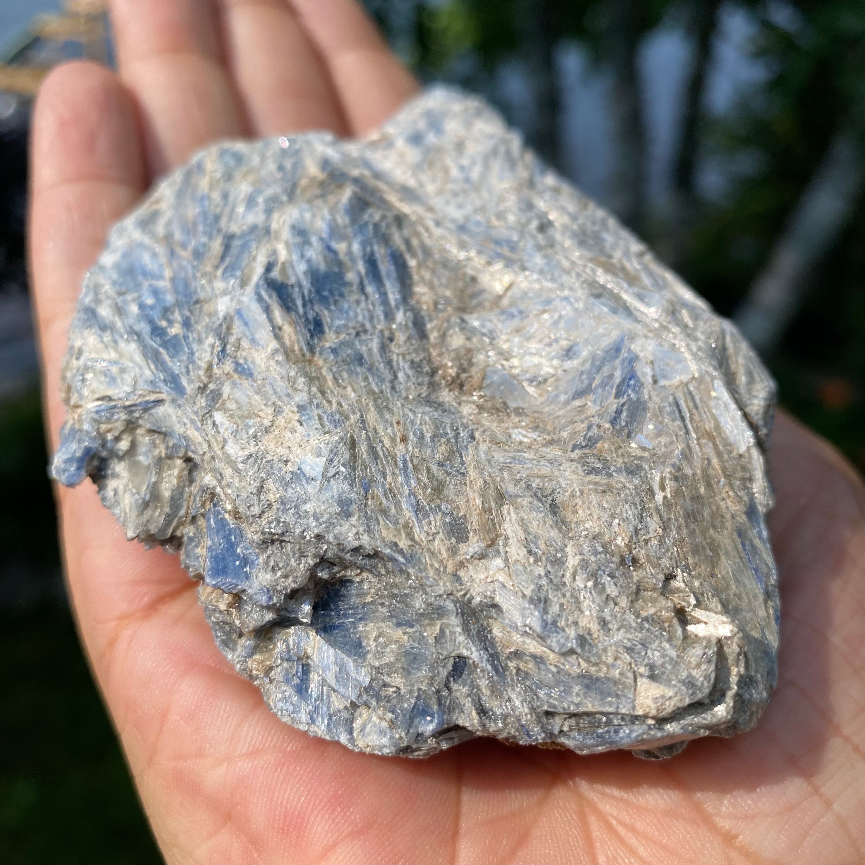 A beautiful light blue Kyanite cluster with Mica inclusions, showcasing its unique natural formations.