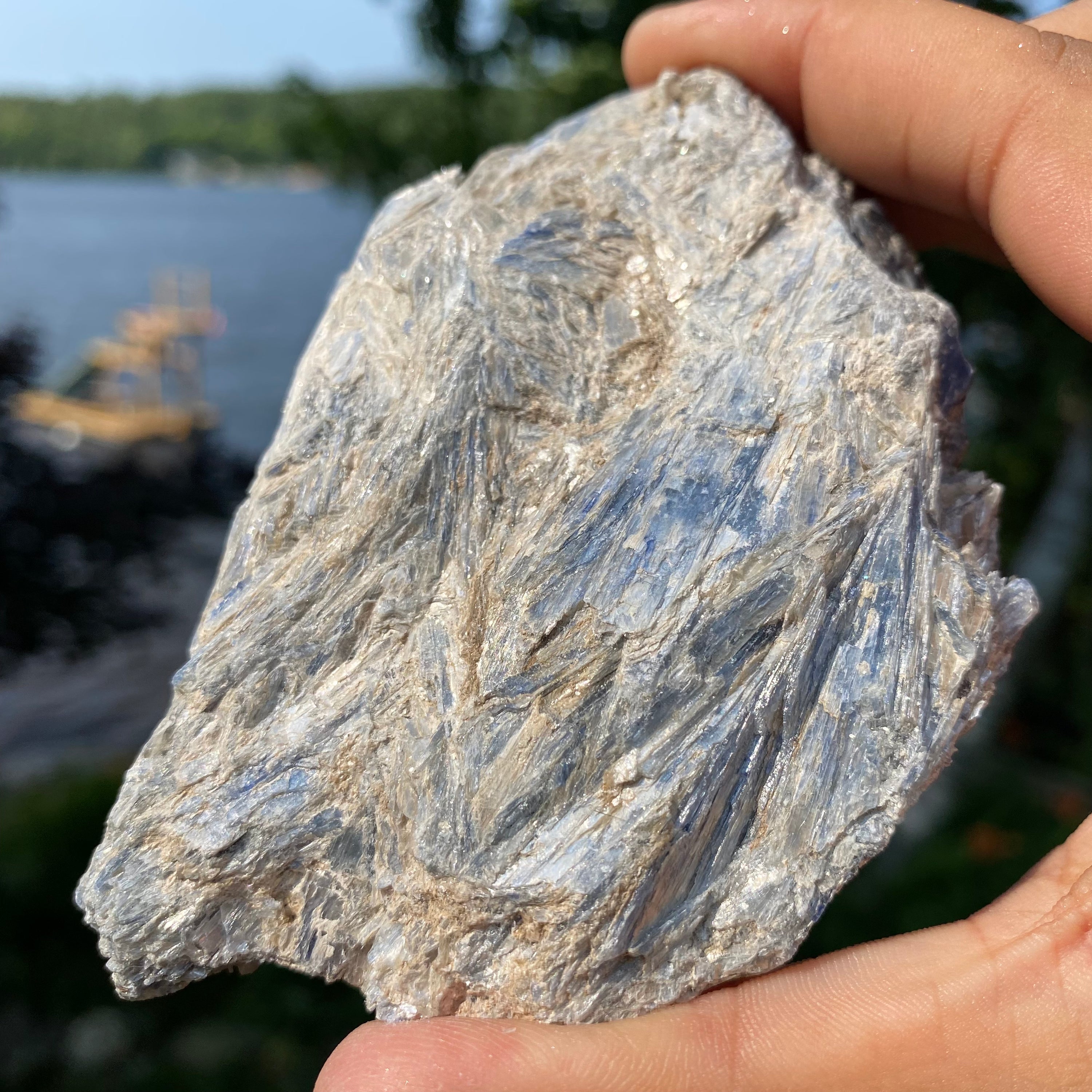 A beautiful light blue Kyanite cluster with Mica inclusions, showcasing its unique natural formations.