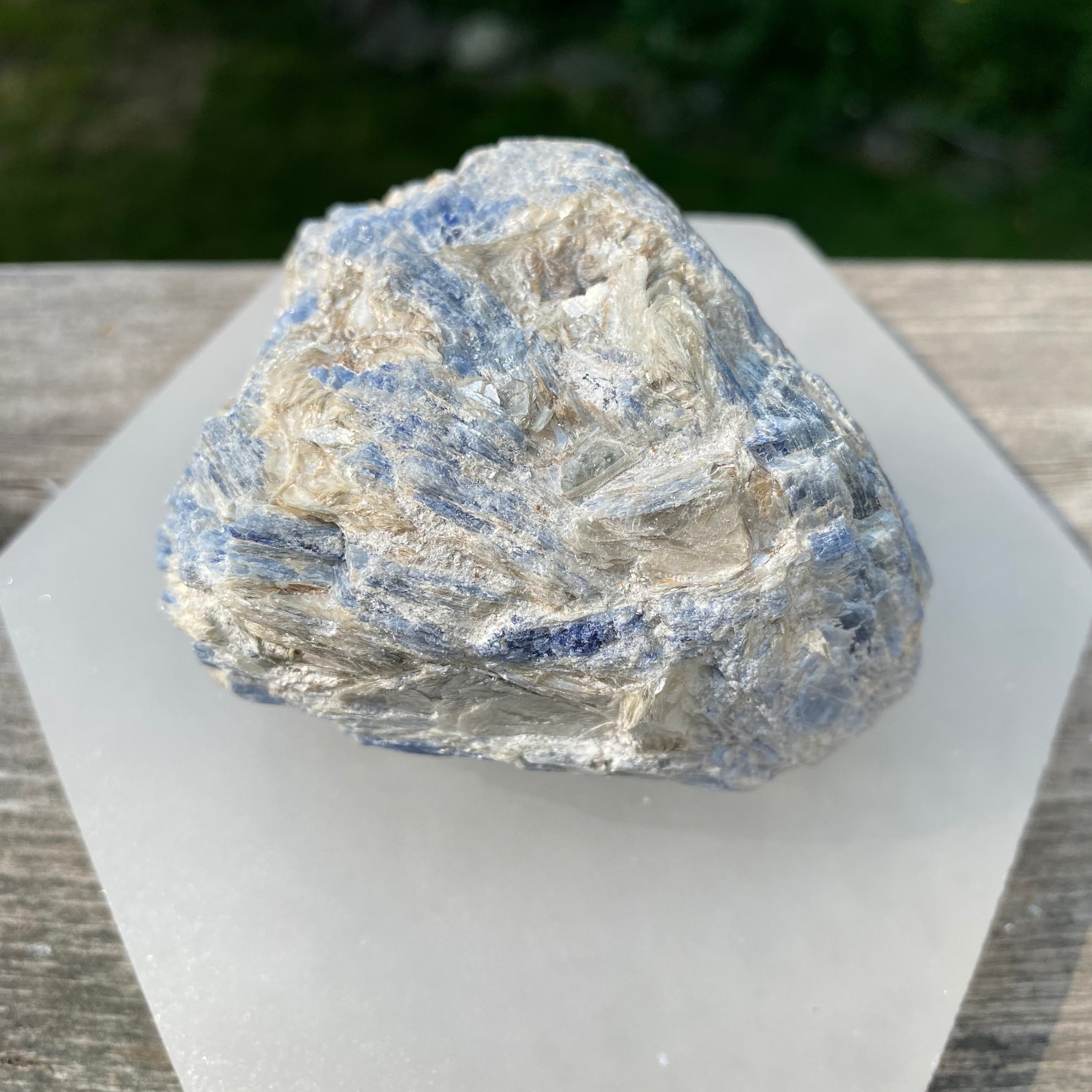 A beautiful light blue Kyanite cluster with Mica inclusions, showcasing unique natural formations and textures.
