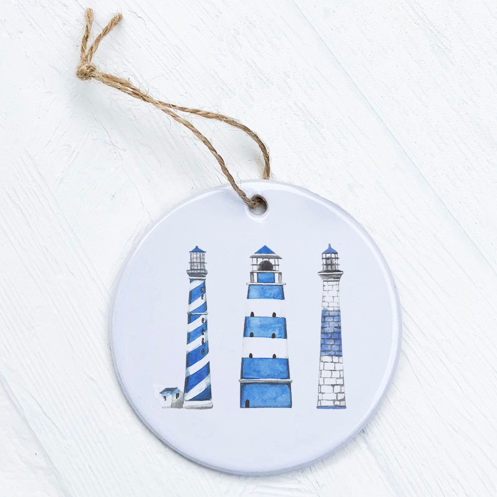 A beautiful Blue Lighthouses Ornament made of high-quality porcelain, featuring a vibrant design of blue lighthouses.