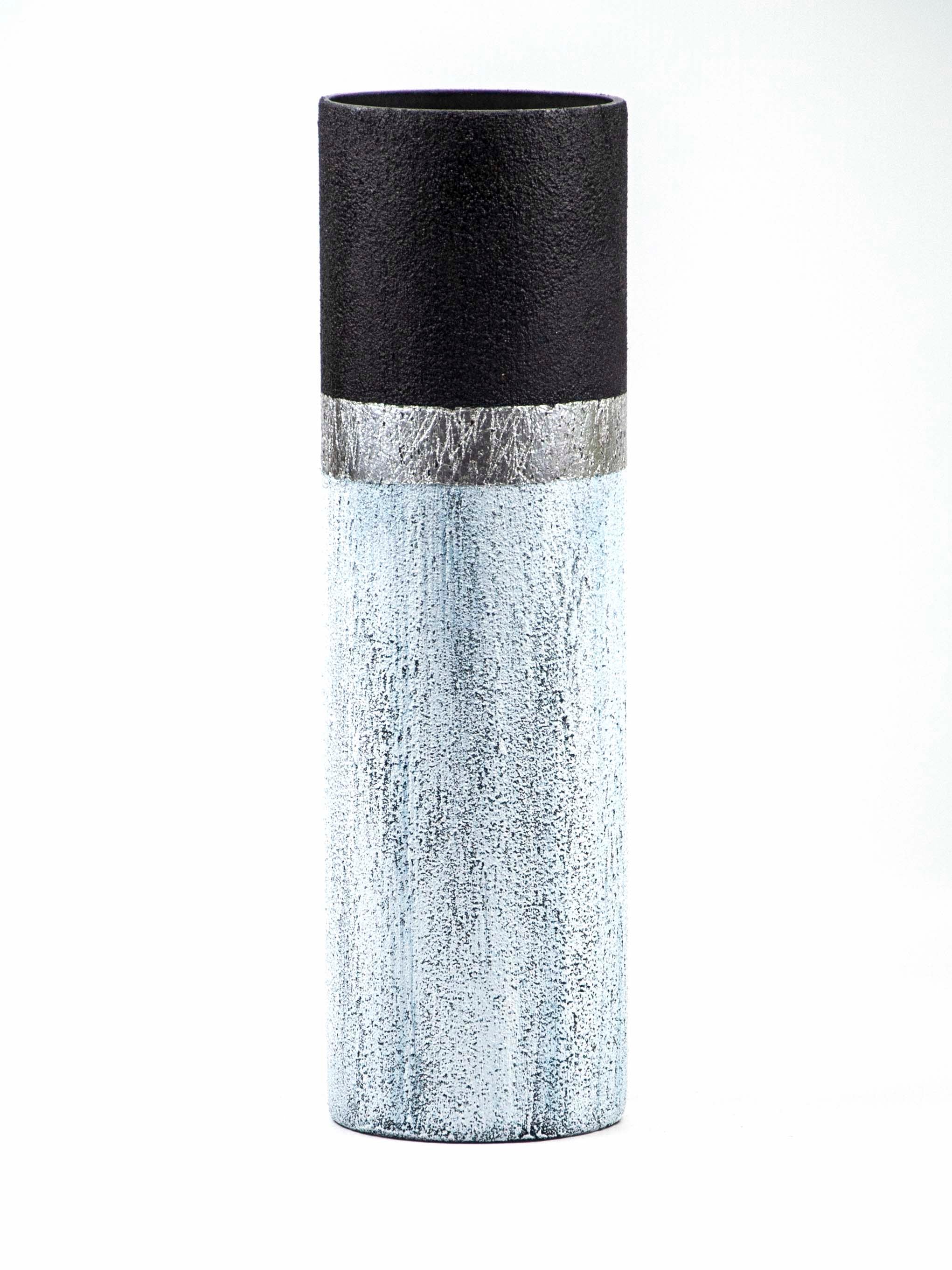 A beautifully hand-painted blue stone imitation vase made of glass, showcasing intricate designs and patterns, perfect for floral arrangements.