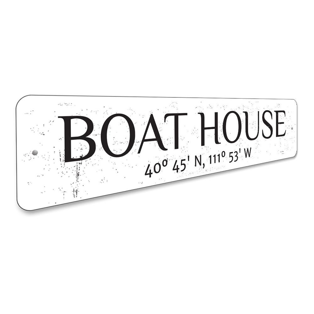 A beautifully crafted Boat House Latitude Longitude Sign made of durable aluminum, showcasing customizable text for lakehouse decor.