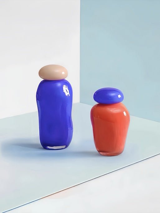 A whimsical Bonbon Glass Jar Ornament in vibrant colors, perfect for home decor and as a bud vase.