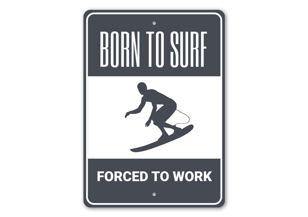 A decorative metal sign reading 'Born to Surf Forced to Work', featuring vibrant colors and a beach-themed design, perfect for coastal decor.