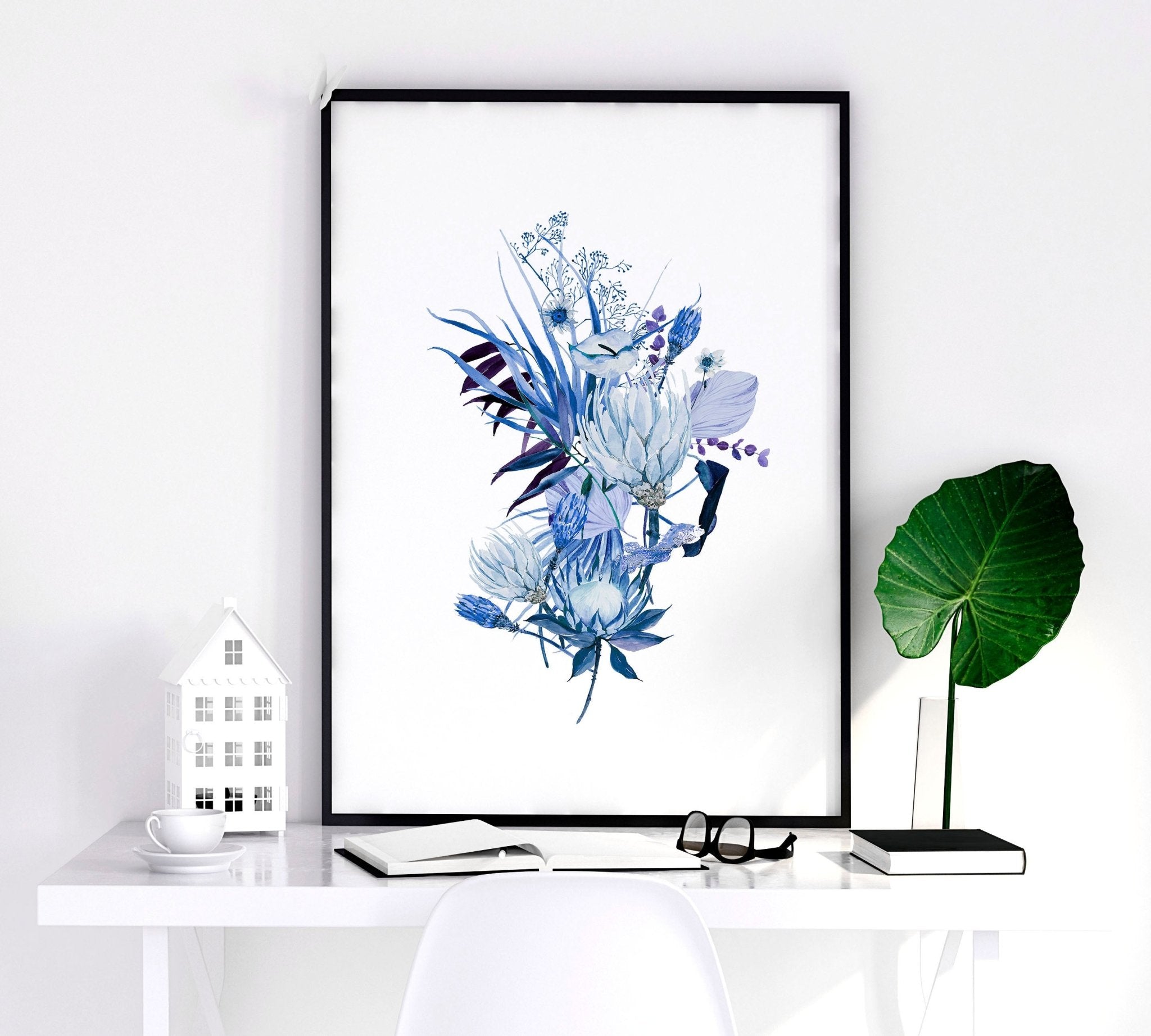 Set of 3 framed Botanical prints featuring intricate blue watercolor illustrations, perfect for home decor.