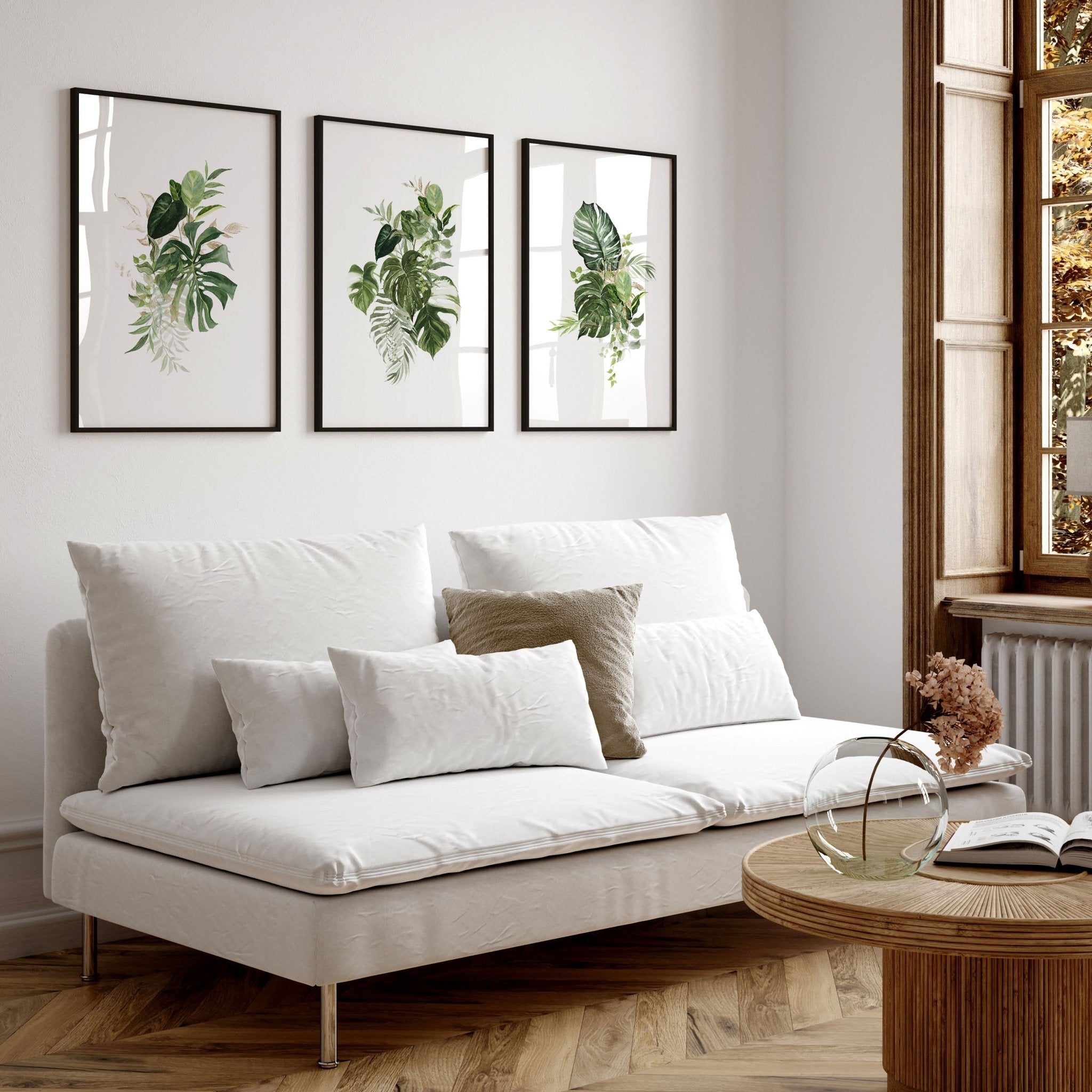 Set of 3 Botanical wall art prints featuring vibrant tropical plants in greens and golds, perfect for enhancing living room decor.