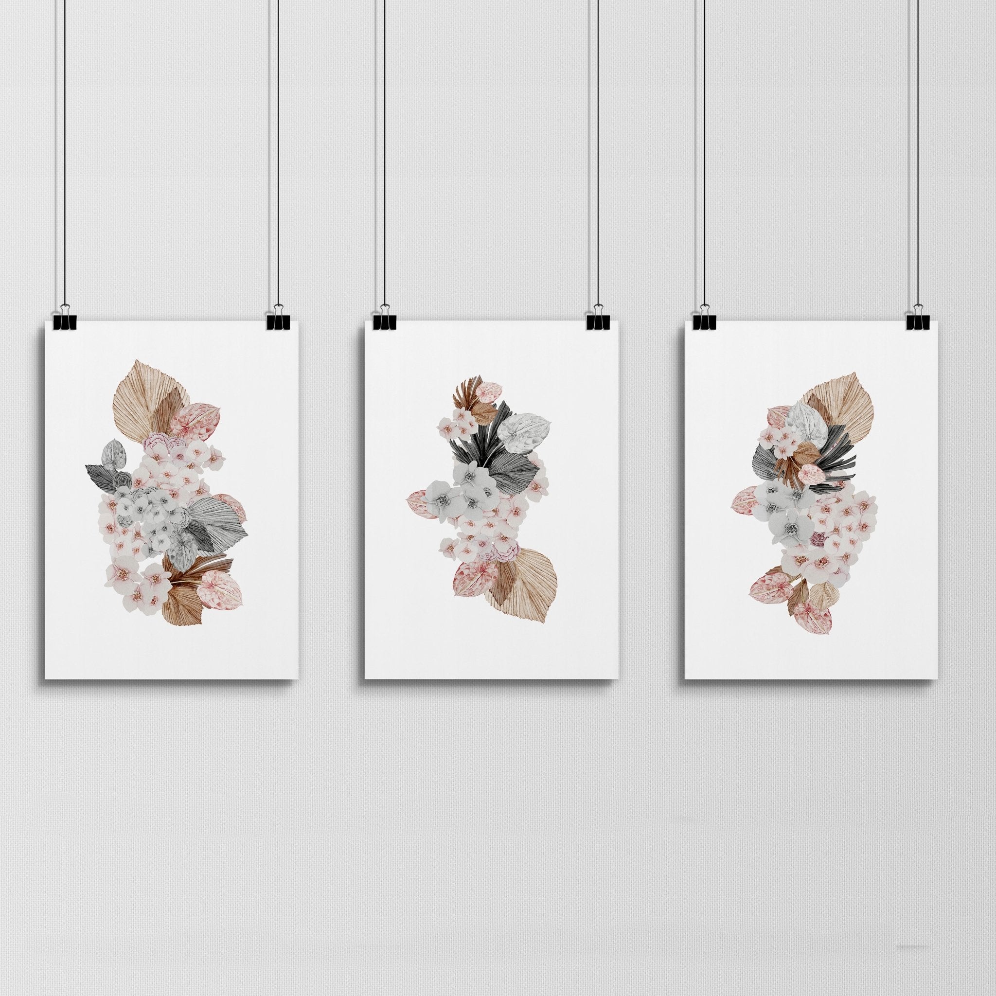 Set of 3 botanical wall art prints featuring delicate flowers in soft pink and grey shades, perfect for home decor.