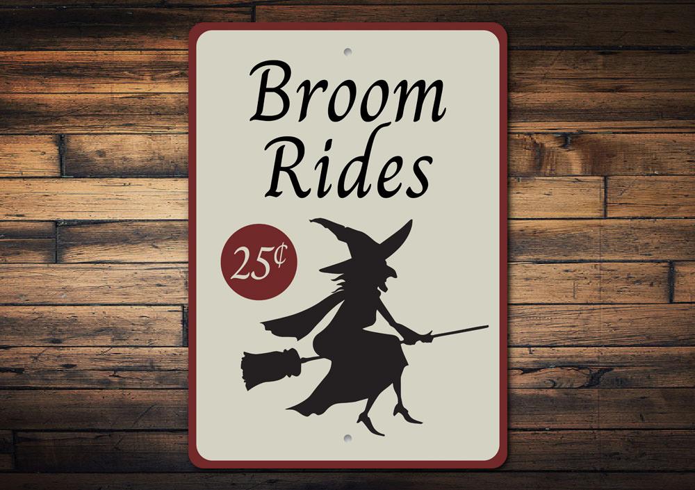 A decorative Broom Rides Sign made of high-quality aluminum, featuring spooky Halloween-themed graphics, perfect for indoor or outdoor display.