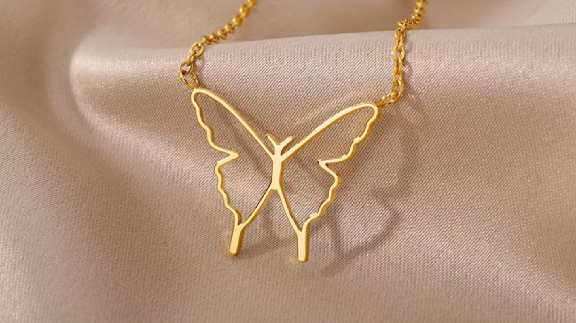 A delicate gold butterfly necklace from Kaelyn and Co's Minimalist Collection, featuring an elegant design perfect for everyday wear.