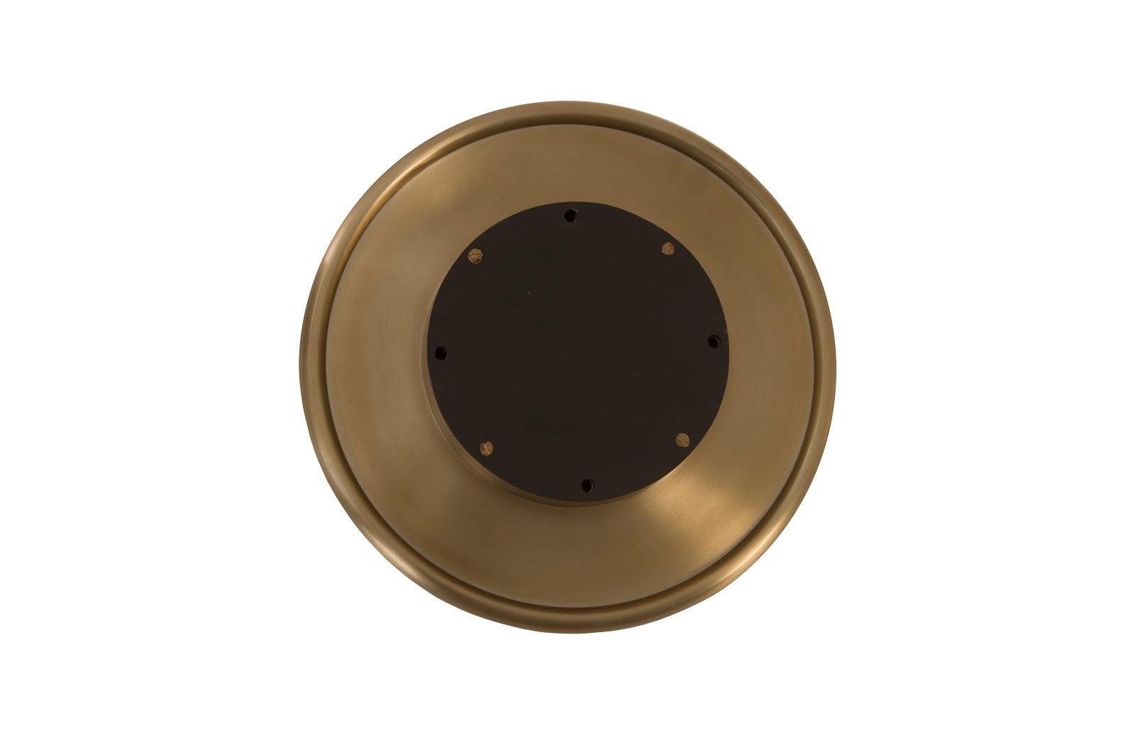 Button Wall Tile featuring a hammered metal design with a brass finish, showcasing its oversized button shape and intricate texture.