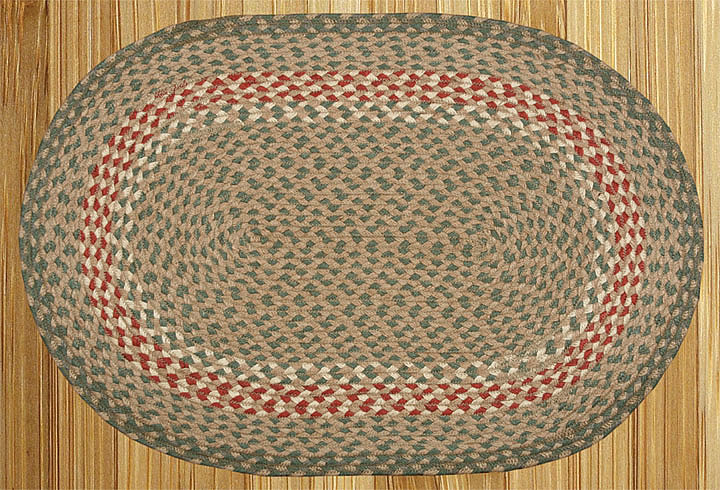 Oval braided rug on wood.