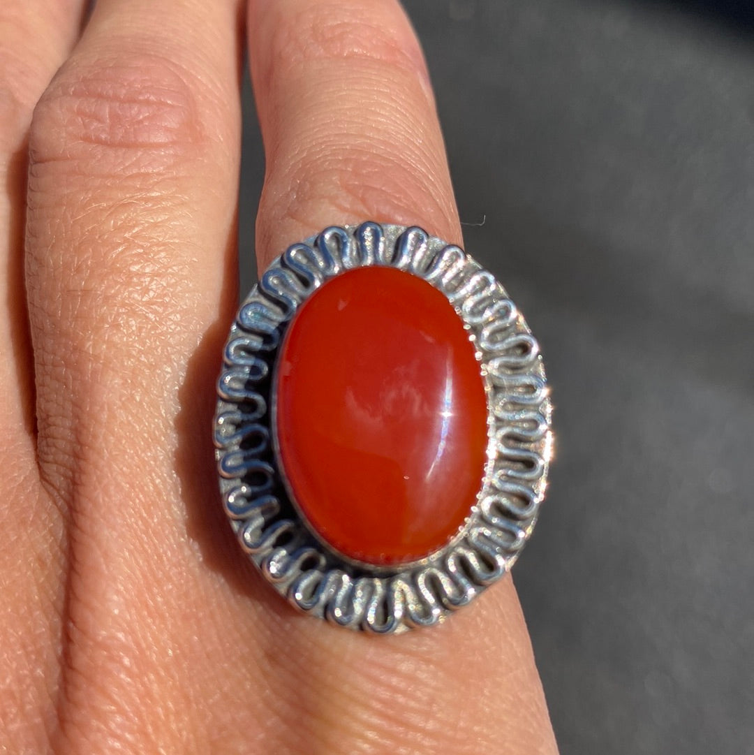 A beautiful Carnelian Sterling Silver Ring, size 6, showcasing a vibrant orange-red stone set in durable sterling silver.