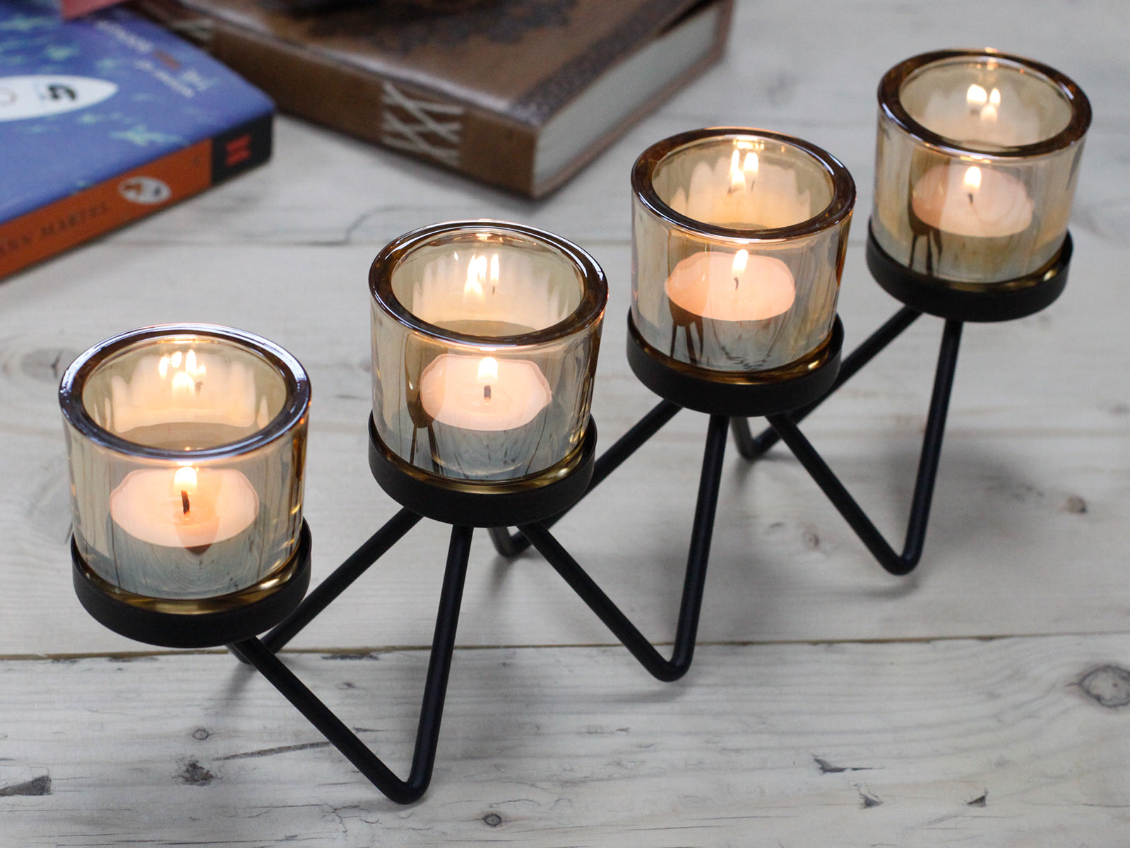 Centrepiece Iron Votive Candle Holder with 4 cups in a zig zag design, showcasing elegant iron craftsmanship.