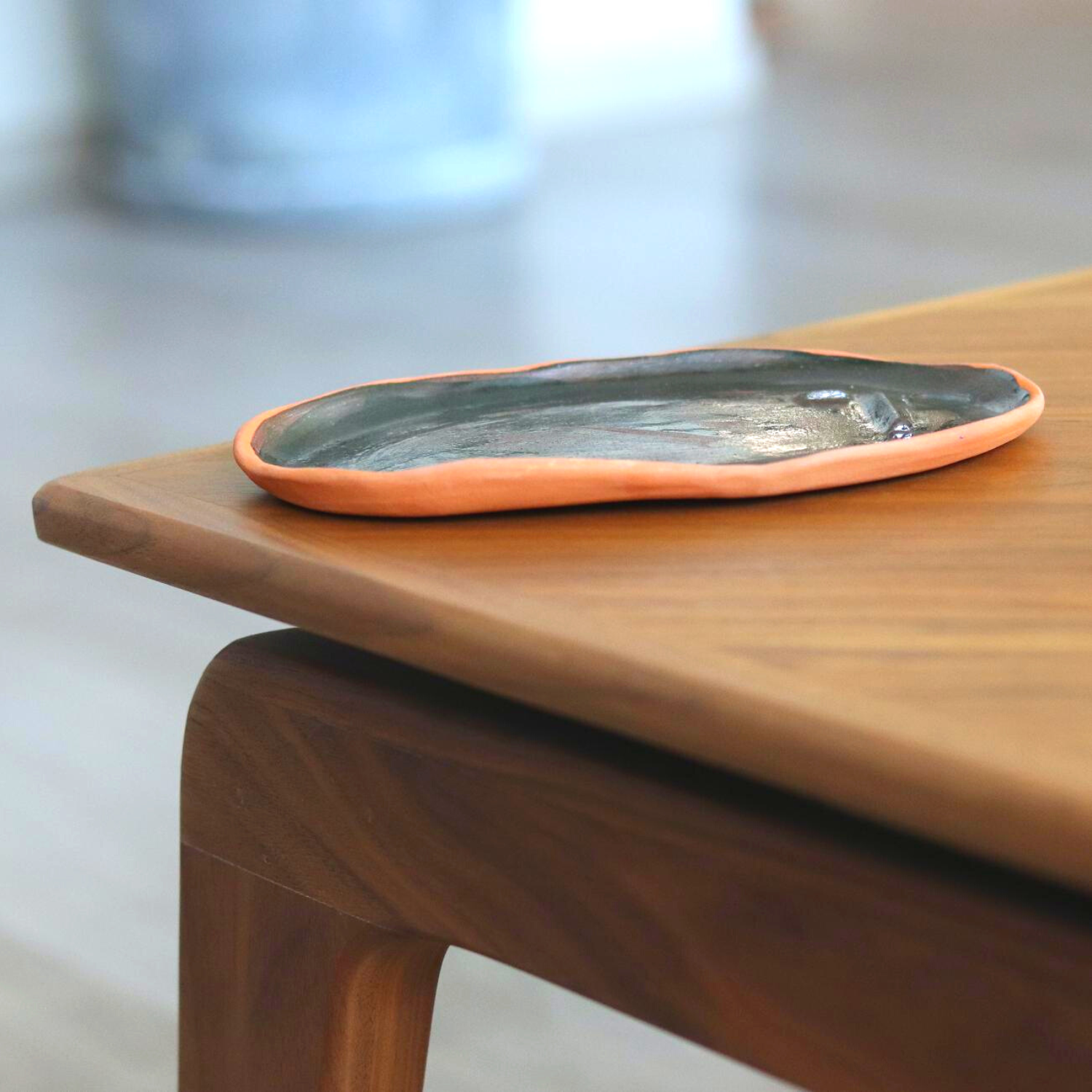 Ceramic Handmade Decorative Tray featuring intricate face details in a deep navy speckled finish, showcasing artisan craftsmanship.