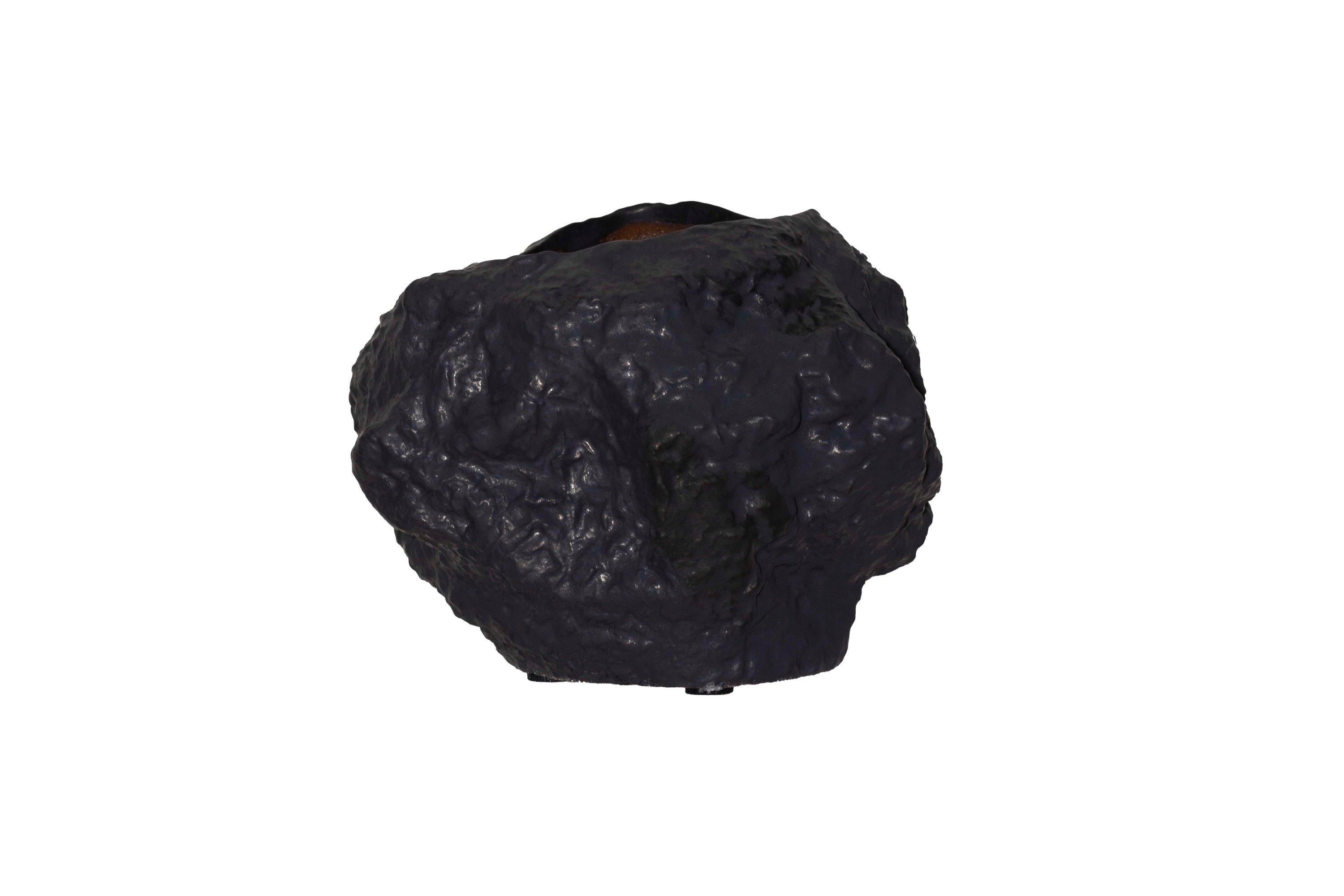 Ceramic vase with a rock-like design in black, showcasing a trendy natural aesthetic.