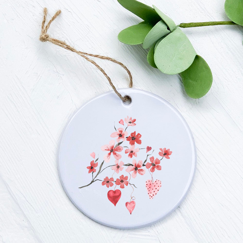 Cherry Blossom Heart Branch porcelain ornament featuring delicate floral design, smooth glossy finish, and 2.75-inch diameter.