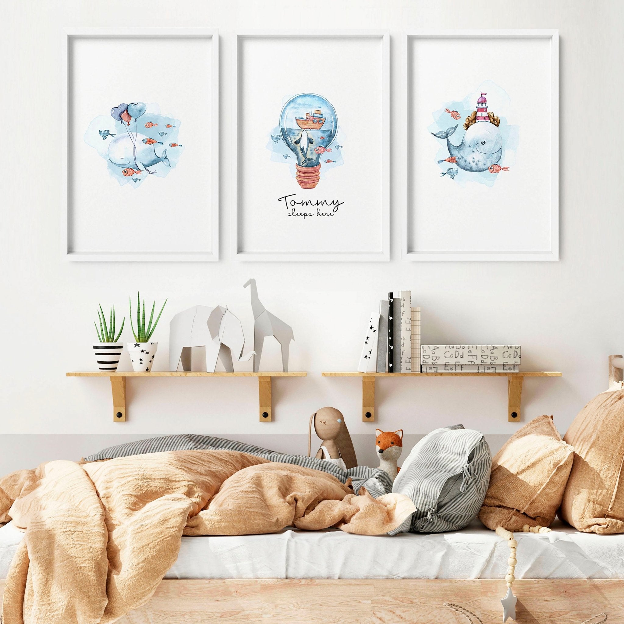 Set of 3 nautical wall art prints featuring majestic whales and enchanting ocean elements, perfect for a child's nursery or playroom.