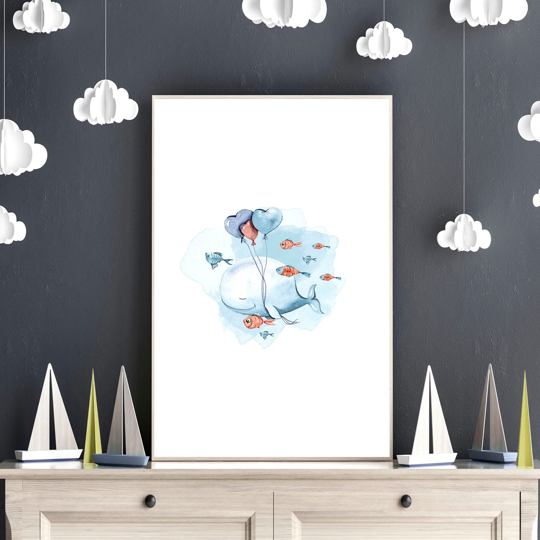 Set of 3 nautical wall art prints featuring majestic whales and enchanting ocean elements, perfect for a child's nursery or playroom.