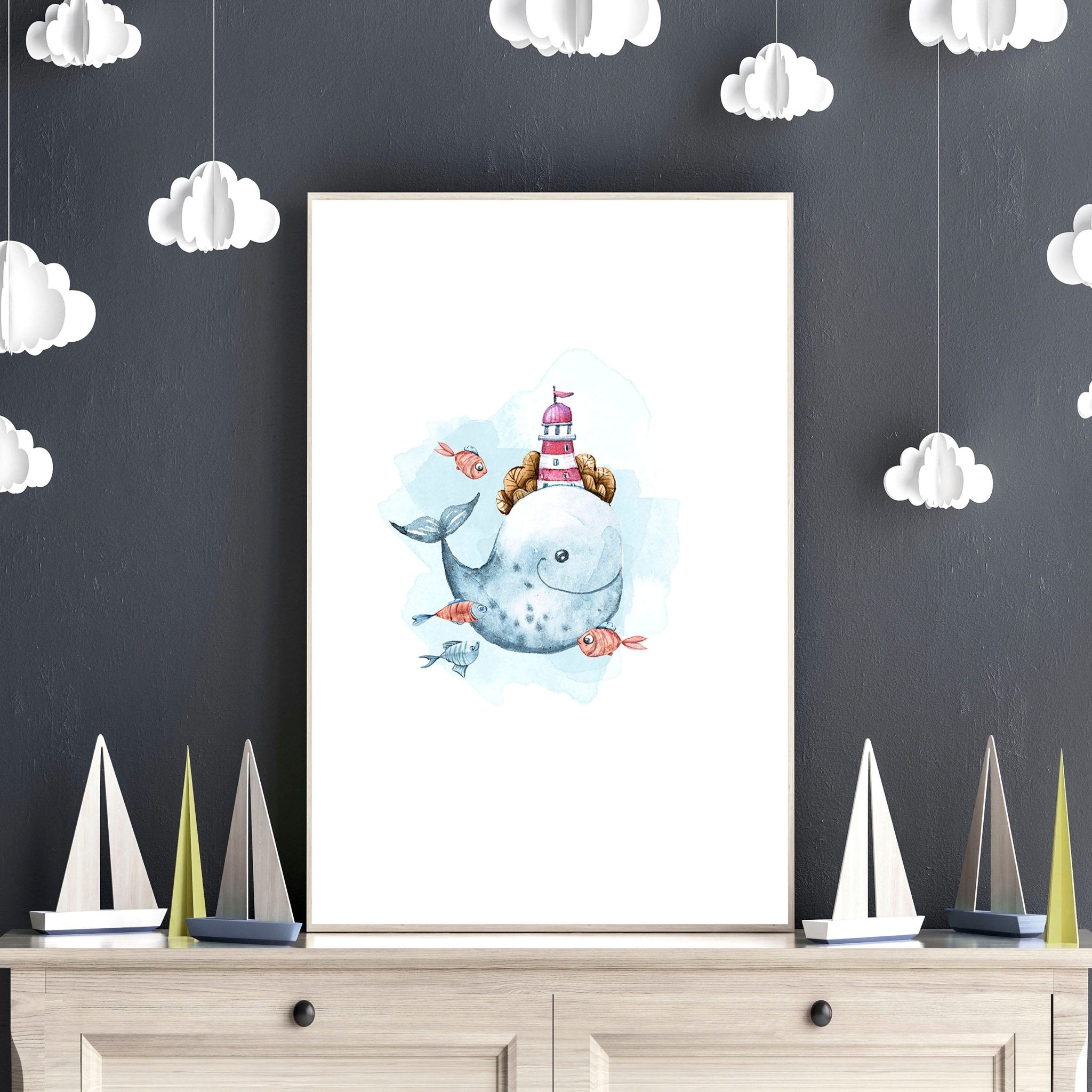 Set of 3 nautical wall art prints featuring majestic whales and enchanting ocean elements, perfect for a child's nursery or playroom.
