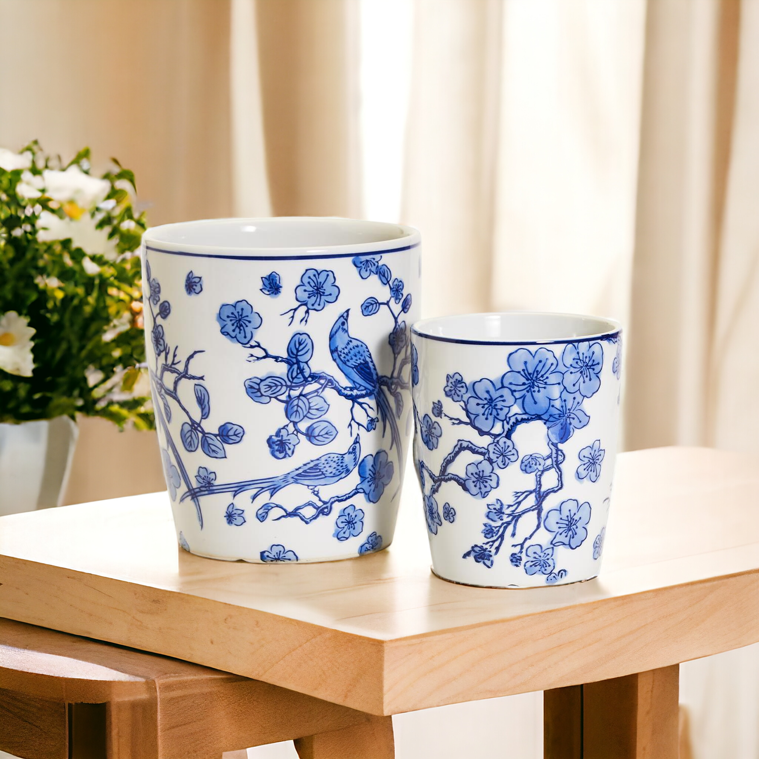 Elegant Chinoiserie vases in classic blue and white design, showcasing intricate hand-painted details, perfect for decor or plant display.