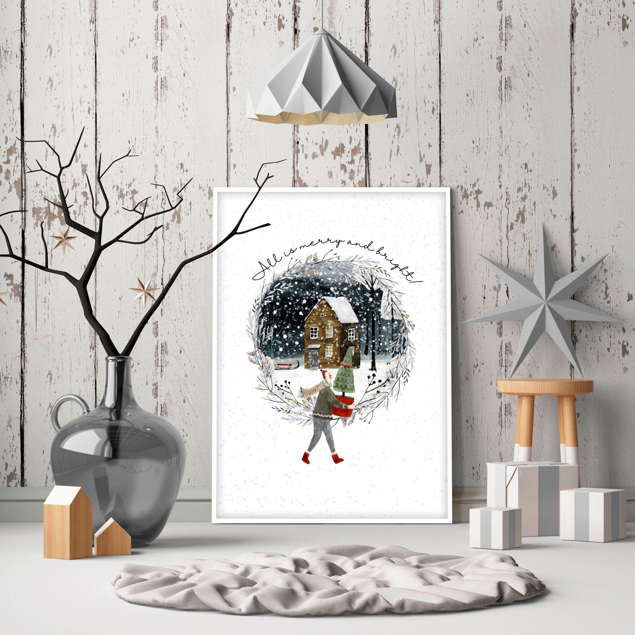 Scandinavian Christmas wall art print featuring a snowy village scene with a person carrying a Christmas tree, perfect for festive home decor.