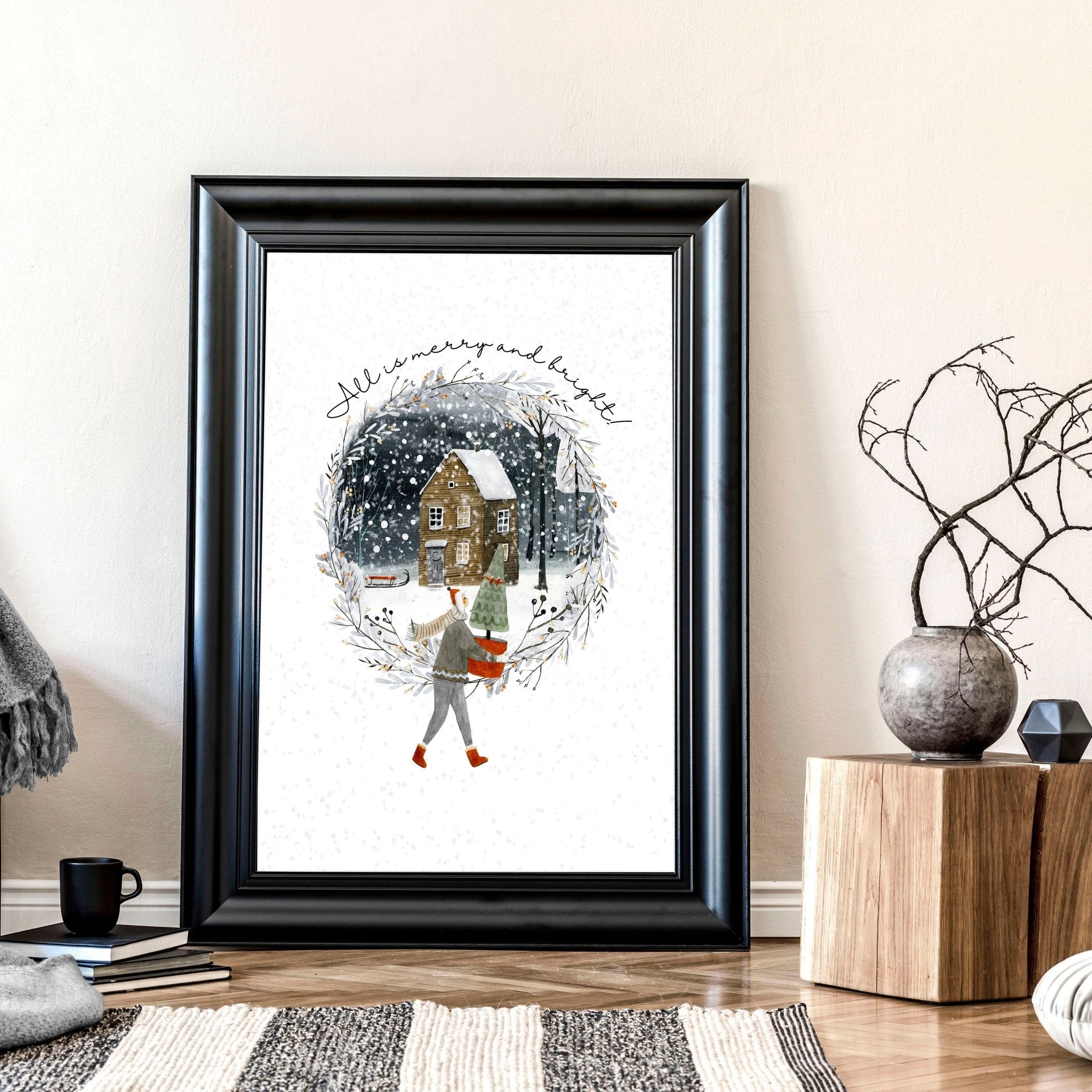 Scandinavian Christmas wall art print featuring a snowy village scene with a person carrying a Christmas tree, perfect for festive home decor.