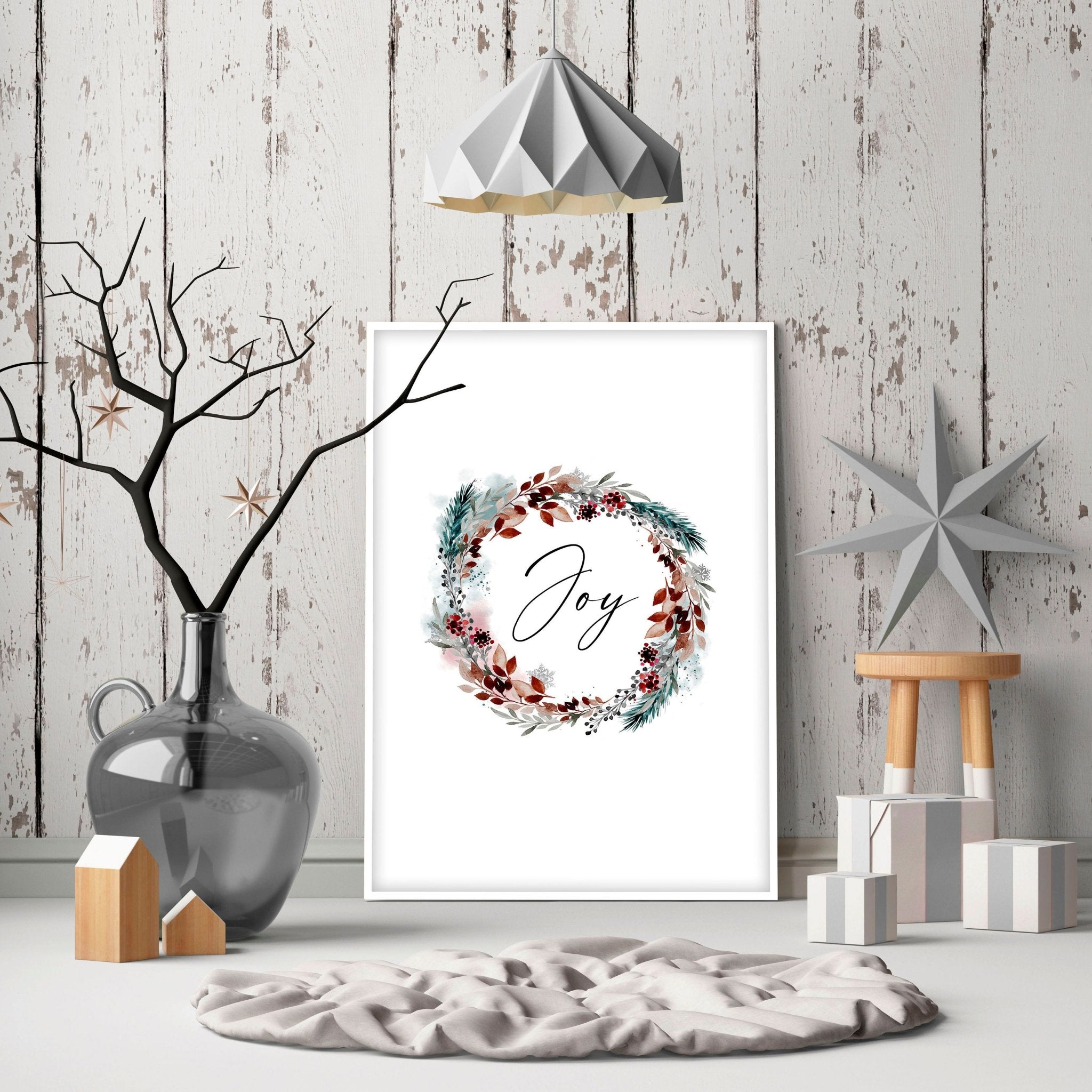 A vibrant watercolour wreath featuring holly leaves and berries with the word 'Joy' elegantly handwritten in the center, perfect for Christmas decor.