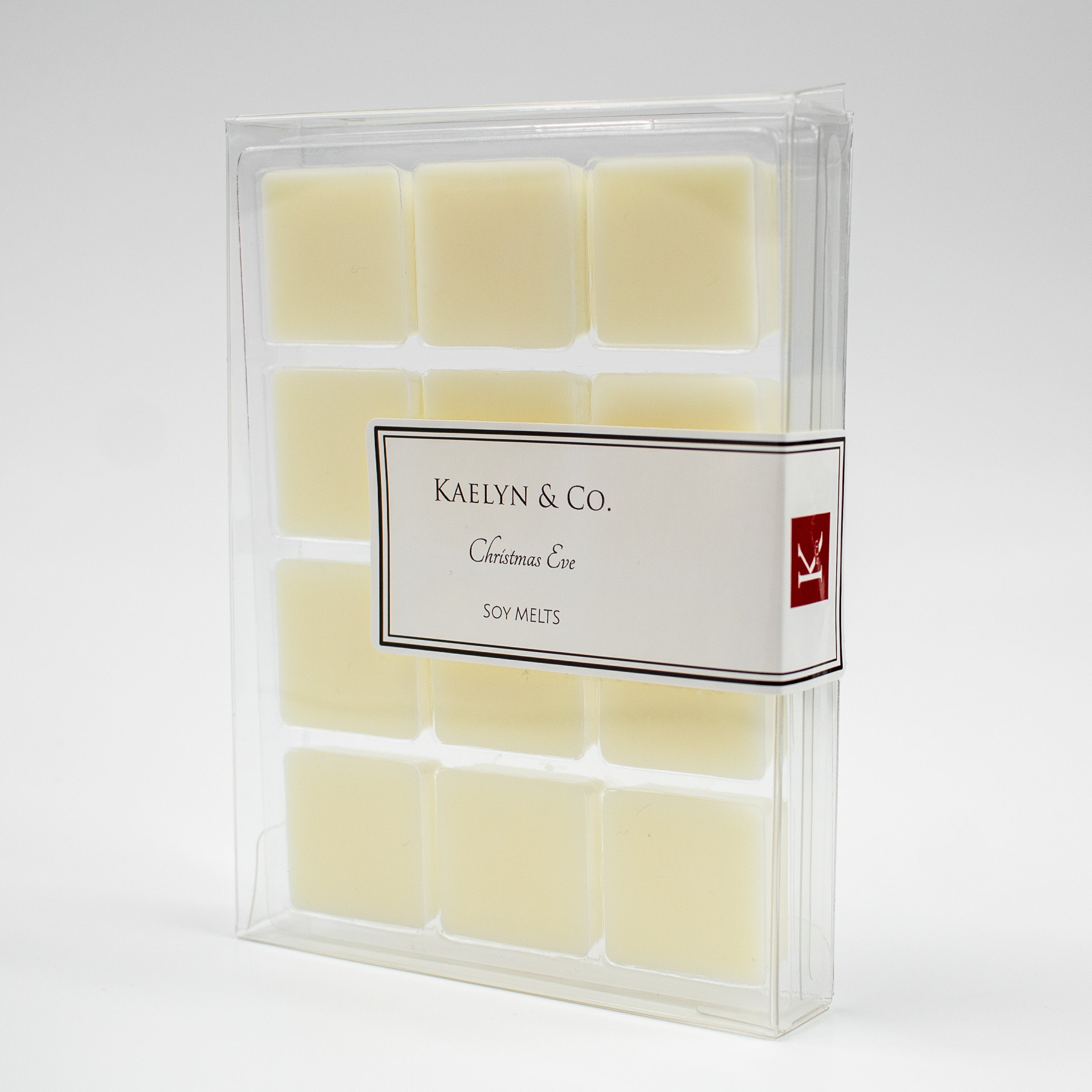 A pack of Christmas Eve Soy Wax Melts featuring twelve cubes with a festive holiday scent of orange spice, fir, and pine.