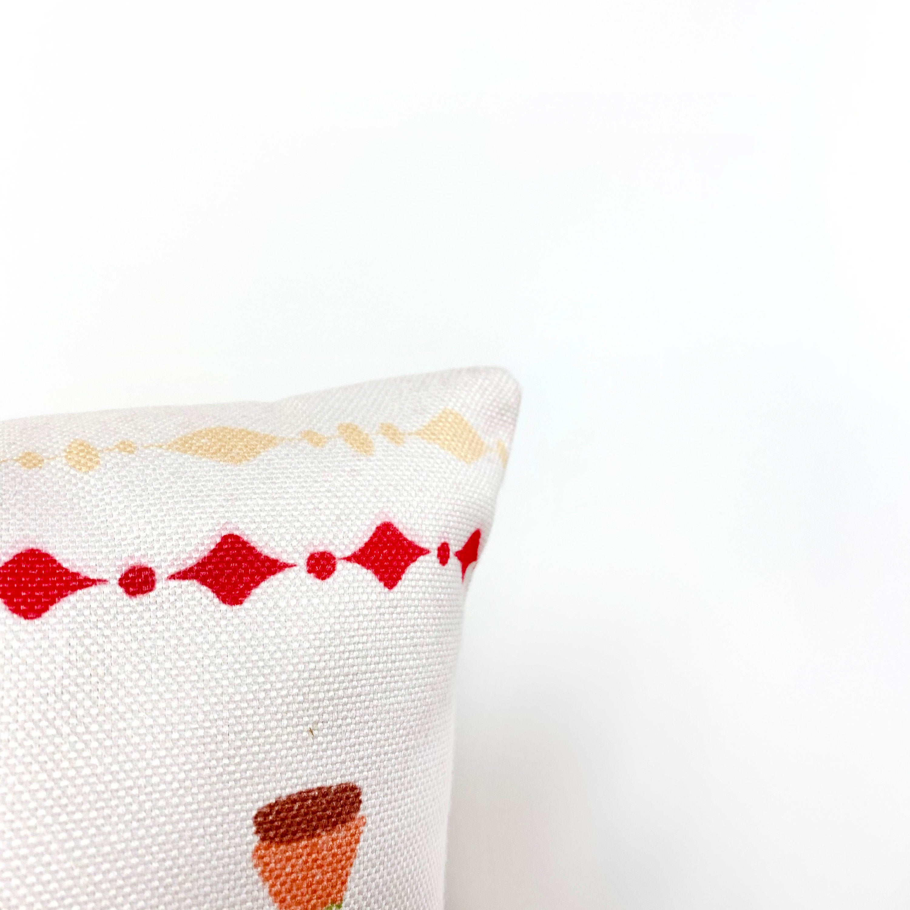 Christmas Gift Train throw pillow cover featuring a toy train carrying wrapped presents on a cream background, perfect for holiday decor.