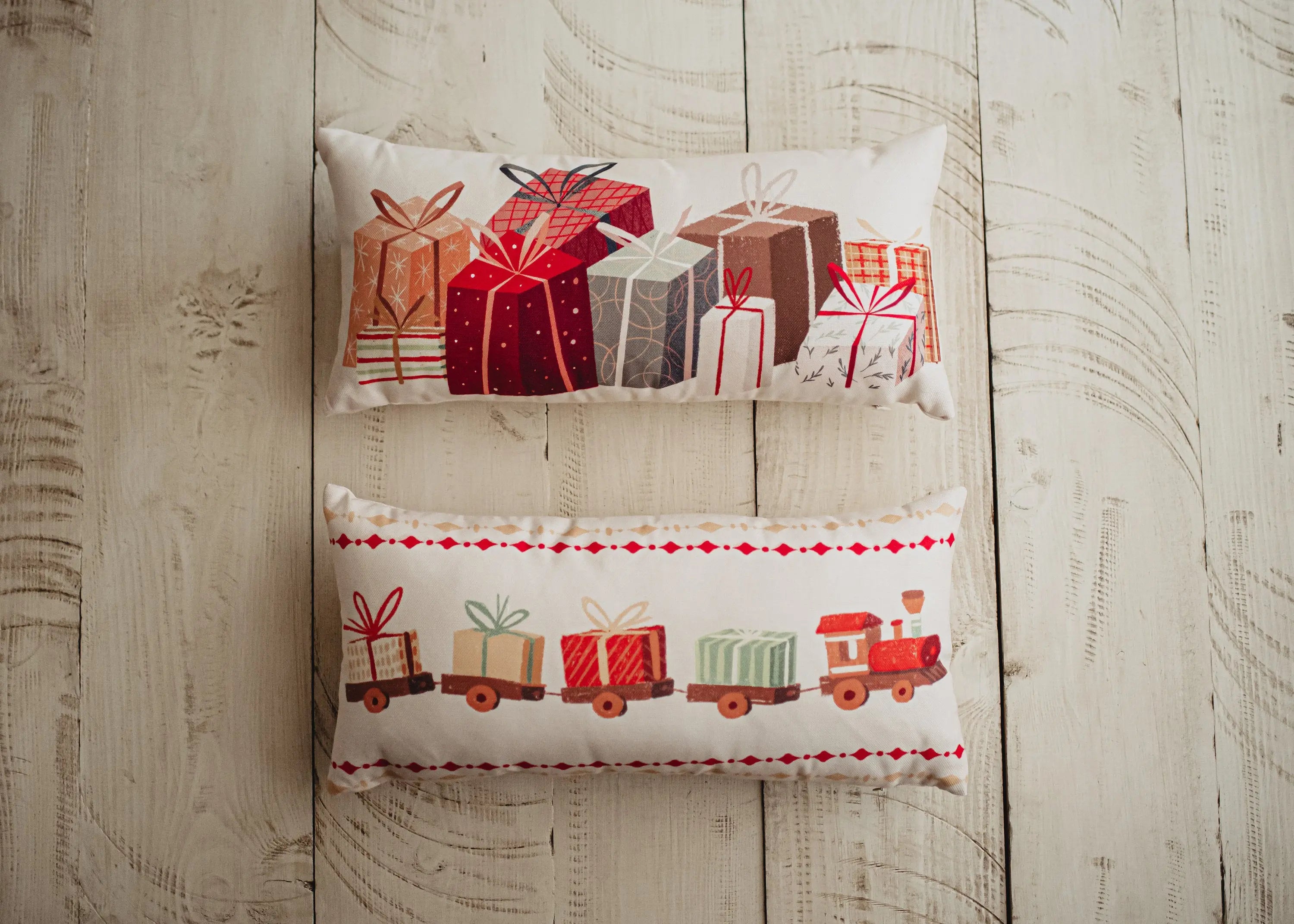 Christmas Gift Train throw pillow cover featuring a toy train carrying wrapped presents on a cream background, perfect for holiday decor.