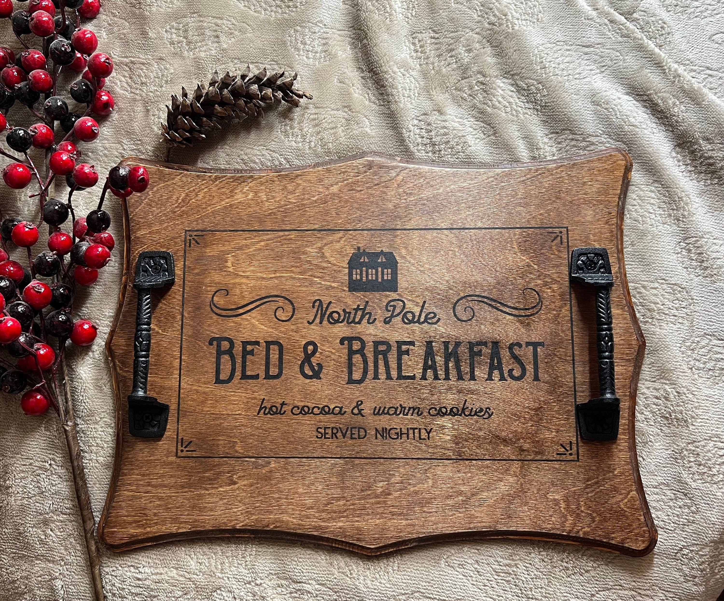 Handmade Christmas serving tray made of birch plywood with a rich chestnut stain, featuring black metal handles and unique wood grain patterns.