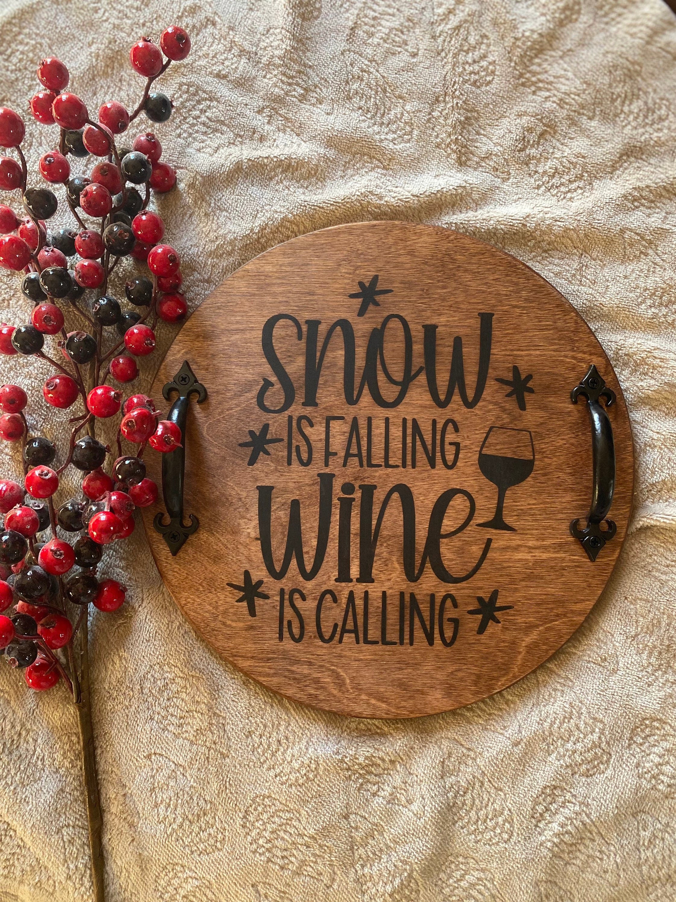 Handmade rustic Christmas serving tray made of birch plywood with a rich chestnut stain and black metal handles, showcasing unique wood grain patterns.