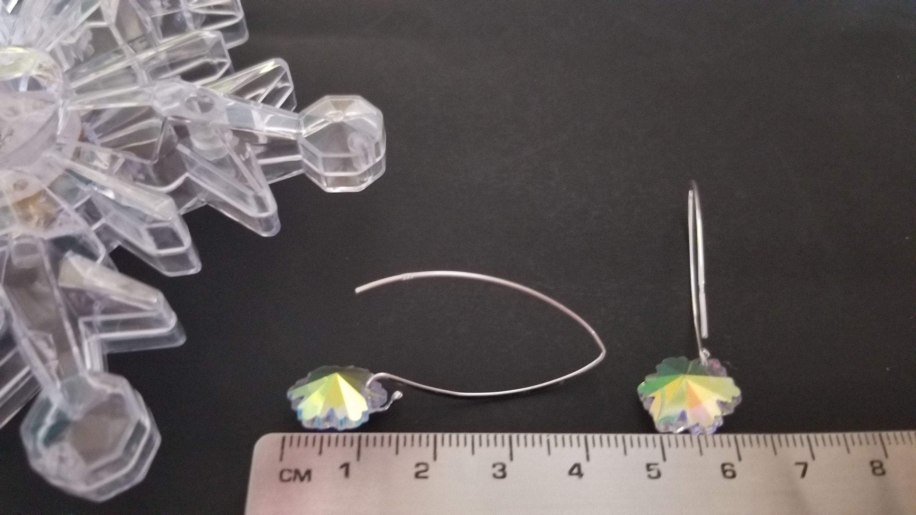 Classic crystal dangle drop earrings made of sterling silver with crystal glass beads, showcasing elegance and craftsmanship.