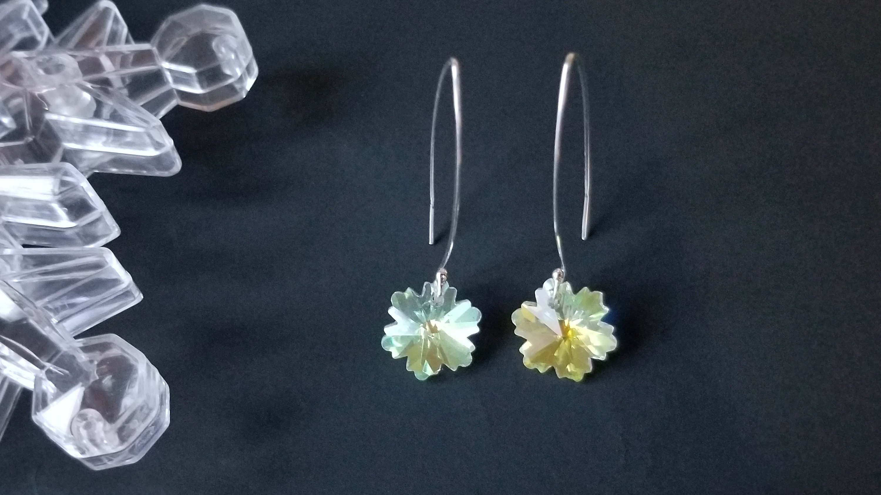 Classic crystal dangle drop earrings made of sterling silver with crystal glass beads, showcasing elegance and craftsmanship.