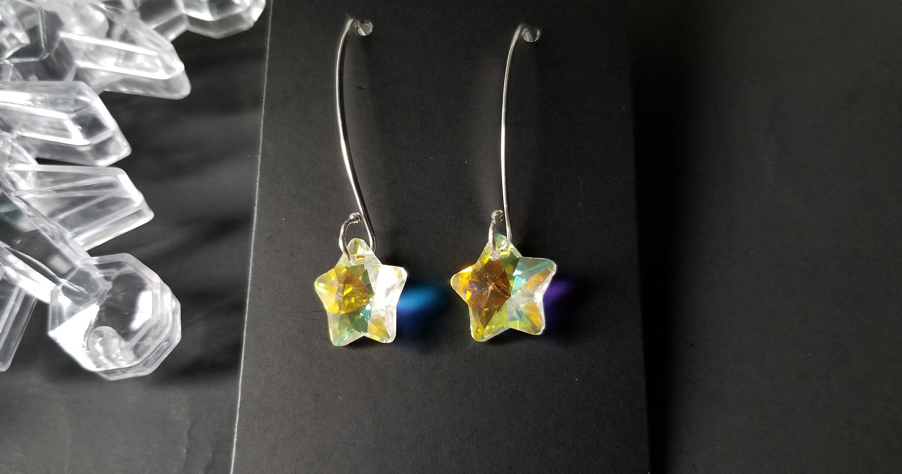 Classic crystal dangle drop earrings made of sterling silver with crystal glass beads, showcasing elegance and craftsmanship.