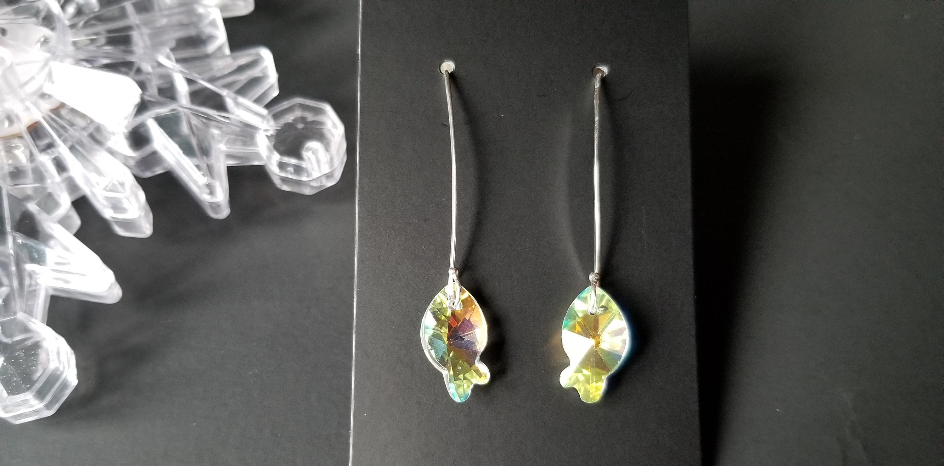 Classic crystal dangle drop earrings made of sterling silver with crystal glass beads, showcasing elegance and craftsmanship.