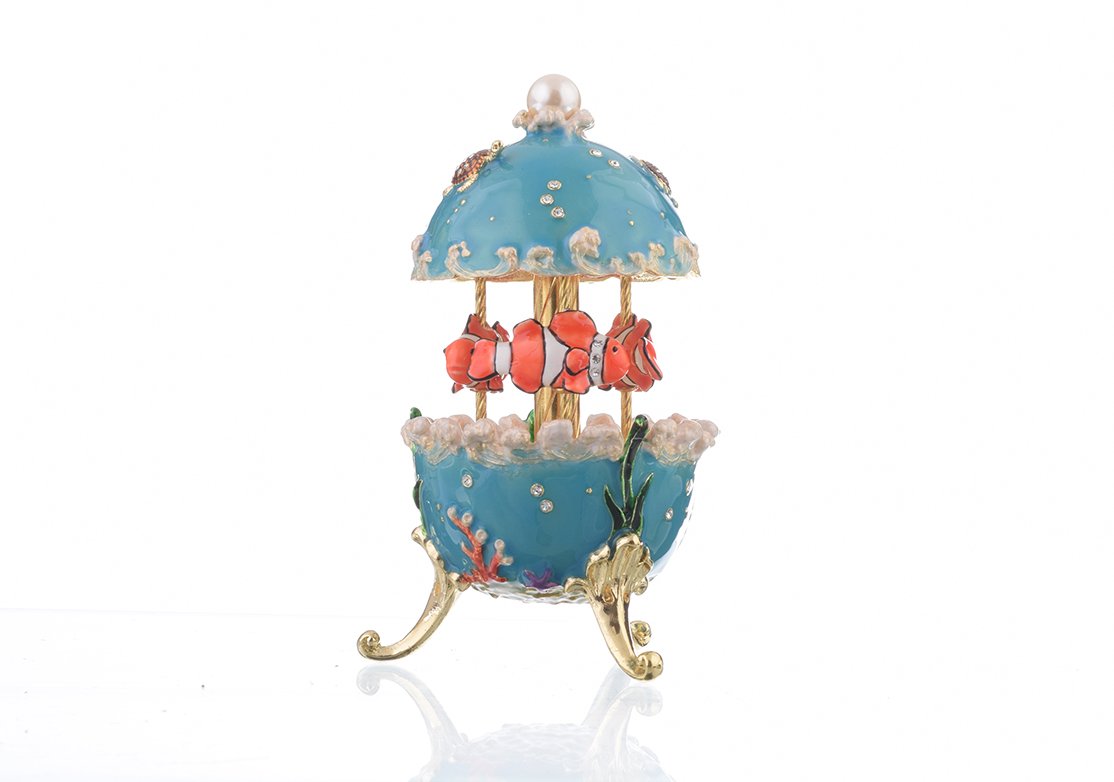 Clownfish Musical Carousel trinket box with Austrian crystals and gold plating, showcasing intricate enamel work and a secure magnetic closure.