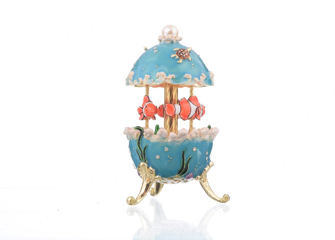 Clownfish Musical Carousel trinket box with Austrian crystals and gold plating, showcasing intricate enamel work and a secure magnetic closure.