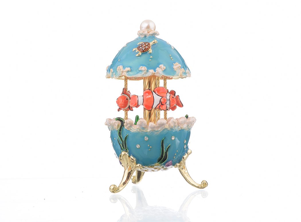 Clownfish Musical Carousel trinket box with Austrian crystals and gold plating, showcasing intricate enamel work and a secure magnetic closure.