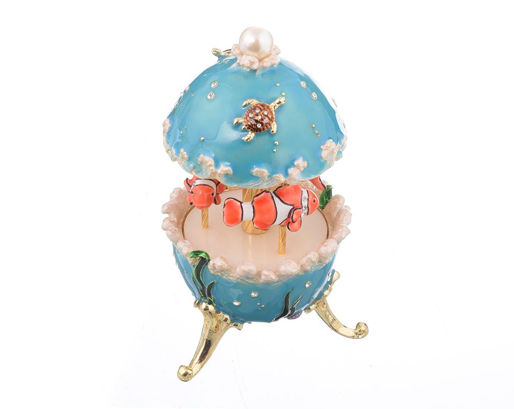 Clownfish Musical Carousel trinket box with Austrian crystals and gold plating, showcasing intricate enamel work and a secure magnetic closure.